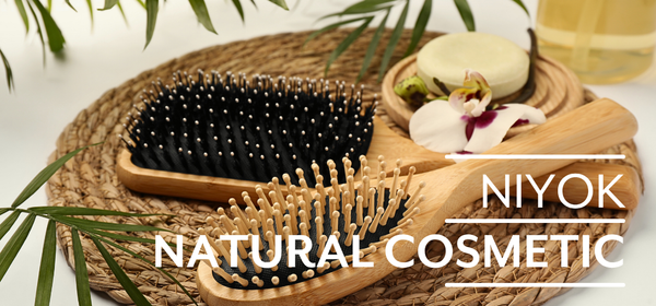 KI generiert: Das Bild zeigt reife Orangen, die an einem Baum hängen. Auf der linken Seite steht der Text "Orangen Kampagne".